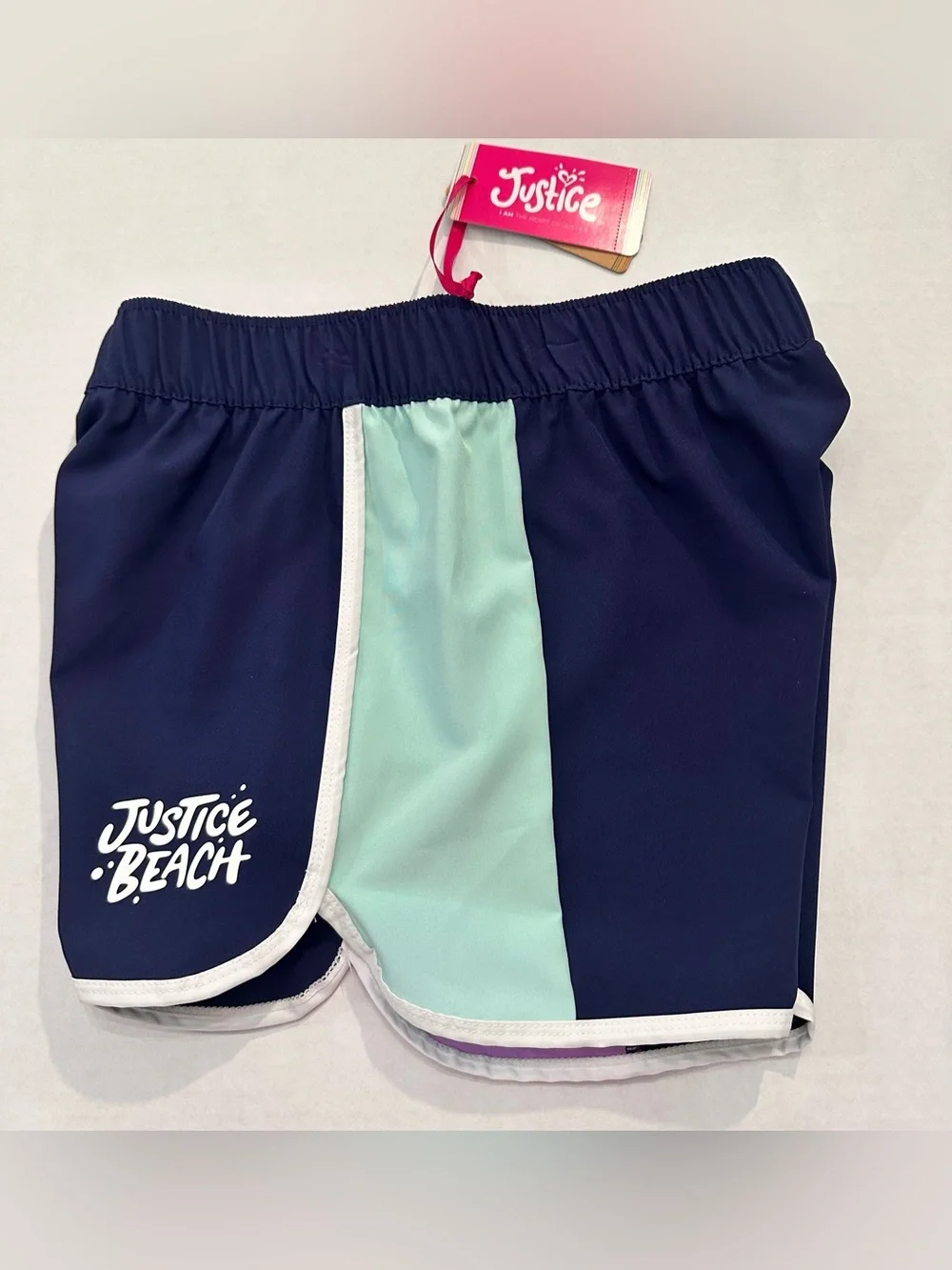 Justice Girls Lilac Butterfly Tank Top and a Pair of Justice Beach Board Shorts